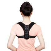 Woman wearing black adjustable back posture correction belt over pink shirt, polyester fiber material