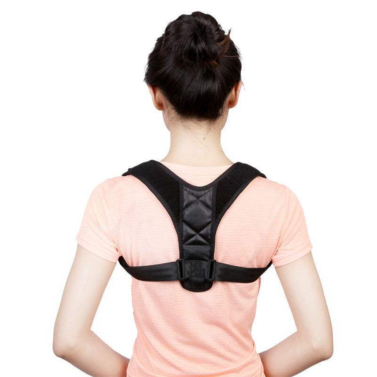 Woman wearing black adjustable back posture correction belt over pink shirt, polyester fiber material