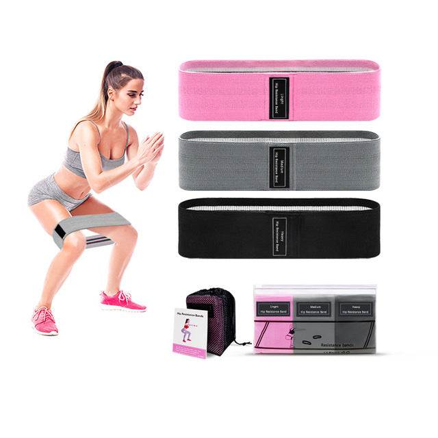 Set of fabric resistance bands in pink, gray, and black for fitness and exercise with carrying bag and instructional card.