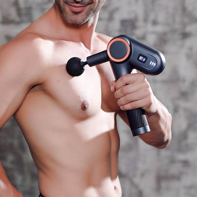 Man using USB rechargeable massage gun with rotatable angle and LED screen on shoulder